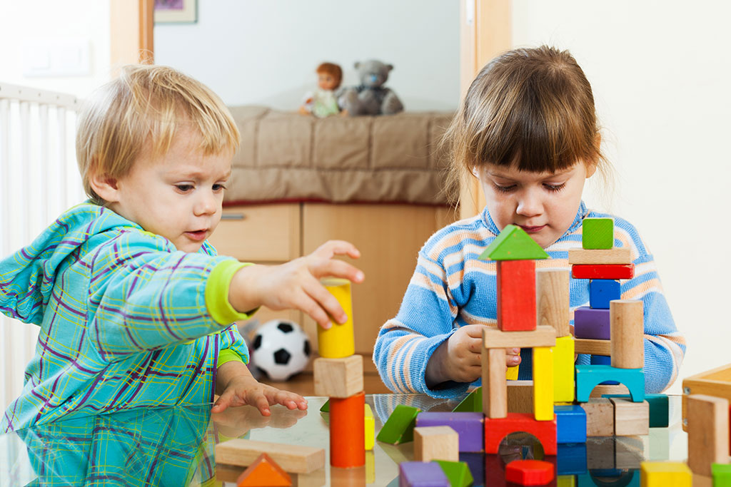 ABA therapist working with a young child on developmental skills